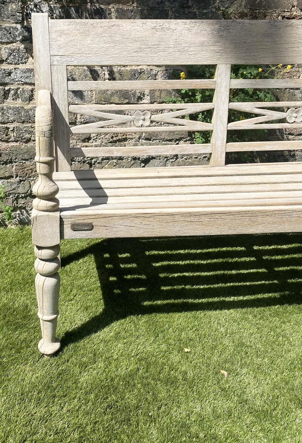 COLONIAL STYLE BENCH, weathered teak with down swept arms and crossed pierced back, 115cm W. - Image 4 of 4