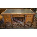 CENTRE DESK, circa 1890, walnut with leather top above five drawers, opposed by dummy drawers on