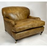 HOWARD STYLE ARMCHAIR, of substantial size, studded tan leather with turned front legs and brass