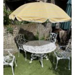 GARDEN SET, circular pierced cast aluminium with four matching armchairs and sun umbrella, table
