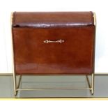 MAGAZINE RACK, 38cm H x 39cm W x 20cm D, tanned leather and a gilt metal frame.