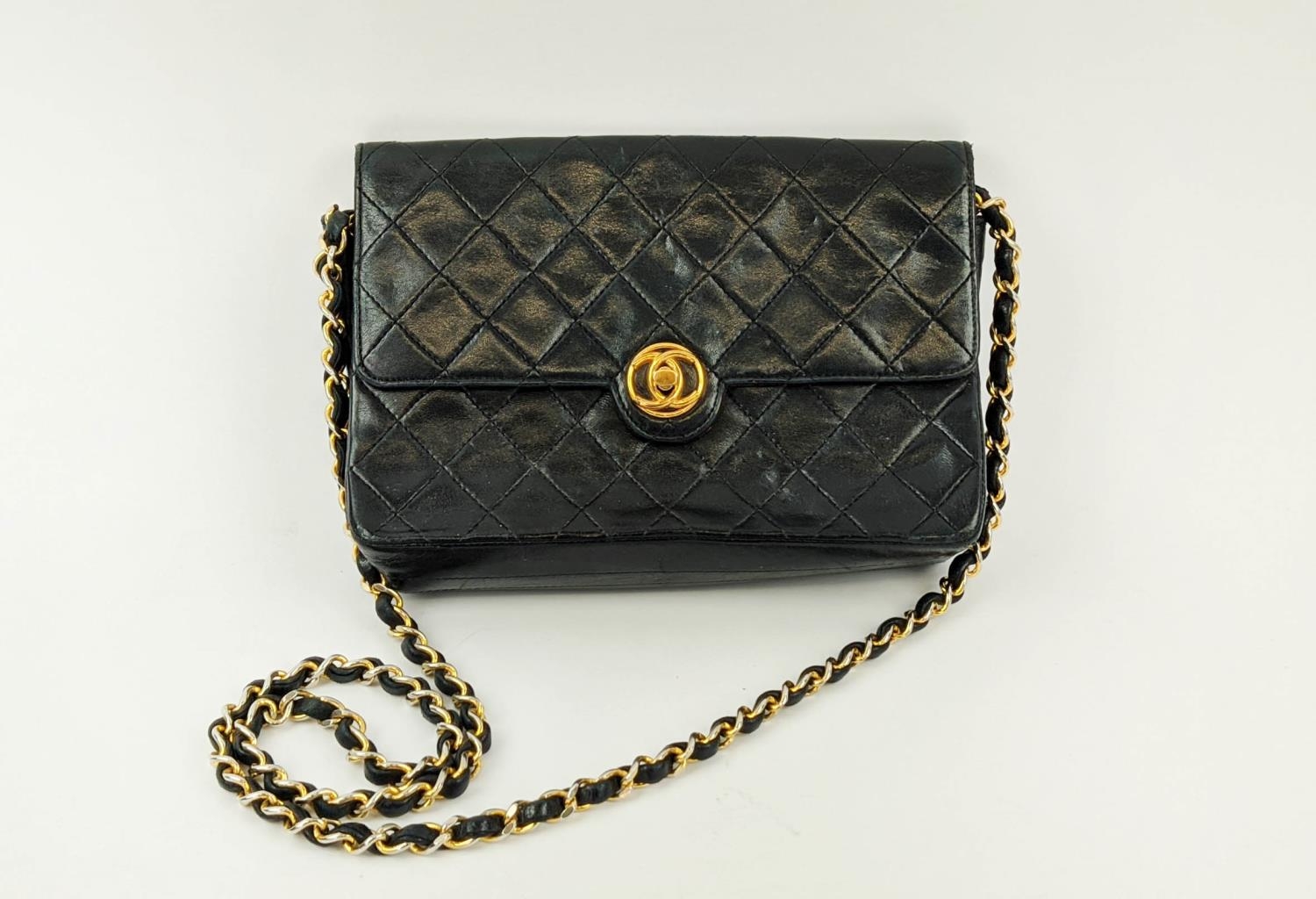 VINTAGE CHANEL FLAP BAG, round turn-lock, iconic burgundy leather lining, quilted front and back