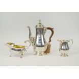 A COLLECTION OF SILVER, comprising a baluster shaped coffee pot and a matching cream jug, marked ?