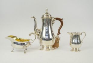 A COLLECTION OF SILVER, comprising a baluster shaped coffee pot and a matching cream jug, marked ?