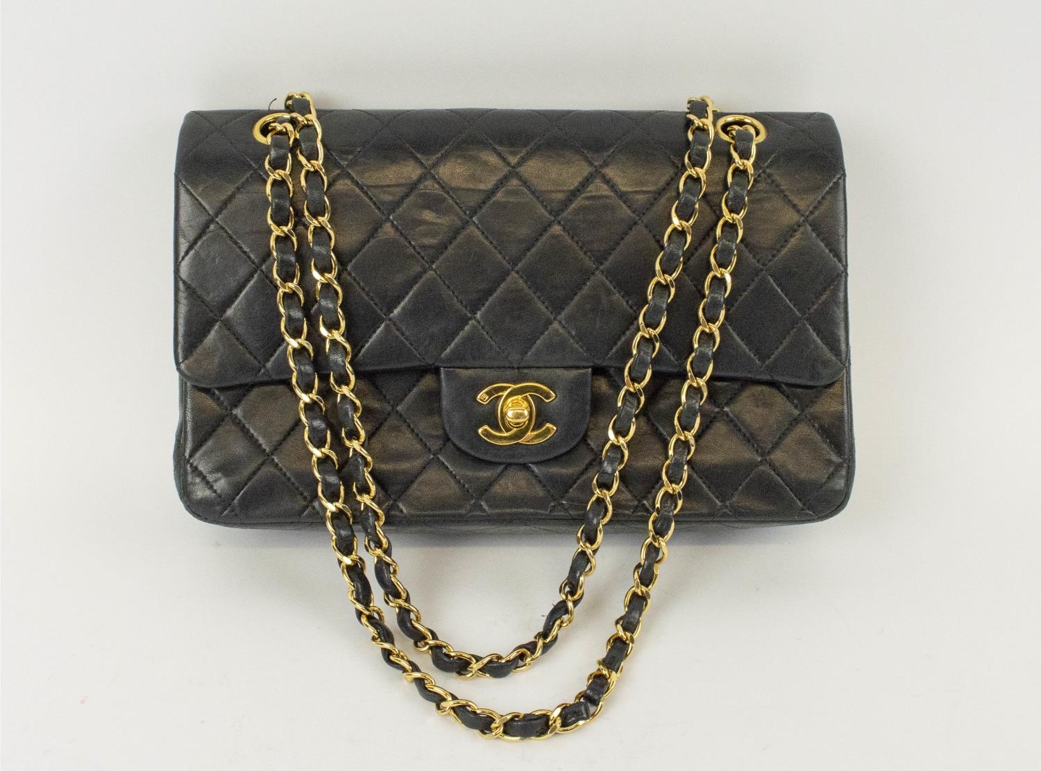 CHANEL FLAP BAG, with front double flap closure, quilted effect and gold hardware, chain and leather