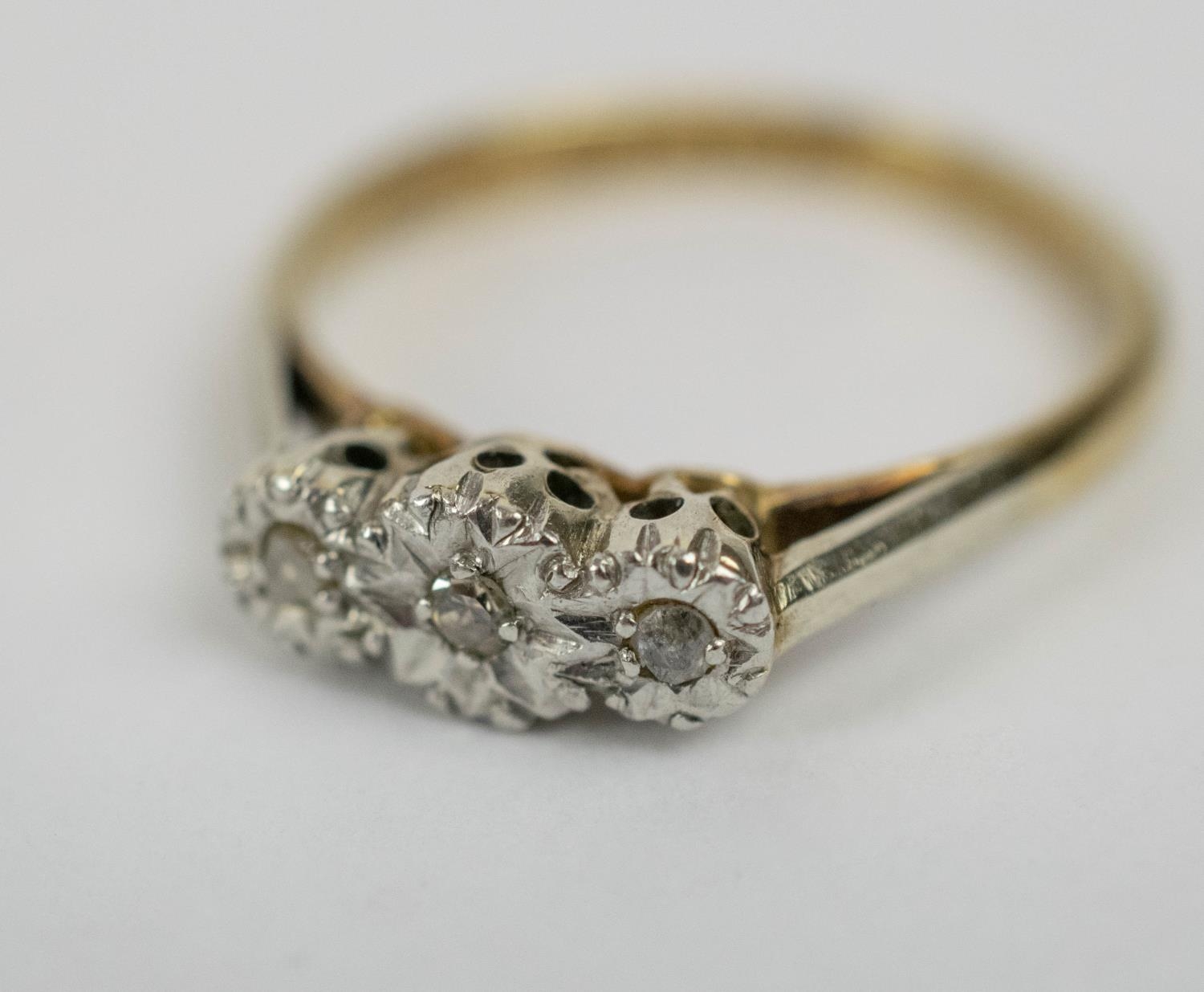 TWO RINGS, comprising a 9ct gold three stone diamond illusion set ring, size N, plus a platinum five - Image 5 of 7