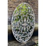 ARCHITECTURAL MIRROR, large oval, 151cm x 102cm, scrolled overlaid cast design over mirror.