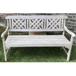 LATTICE GARDEN BENCH, well weathered teak with triple lattice panelled back and slatted seat,