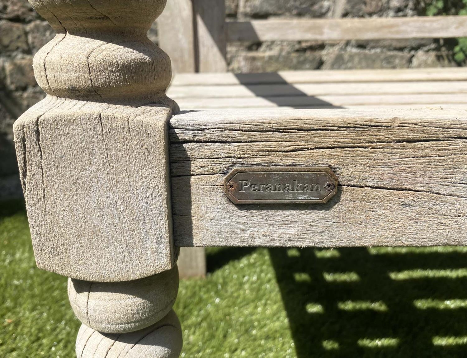 COLONIAL STYLE BENCH, weathered teak with down swept arms and crossed pierced back, 115cm W. - Image 2 of 4