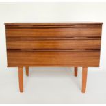 CHEST, 1960's Afromosia teak, with three long drawers, integral handles and shaped tapering