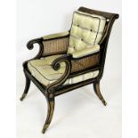 JULIAN CHICHESTER LIBRARY BERGERE, Regency style ebonised, gilt heightened and caned, 58cm W.