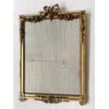 WALL MIRROR, 19th century Italian carved giltwood with ribbon crest and carved floral swags and