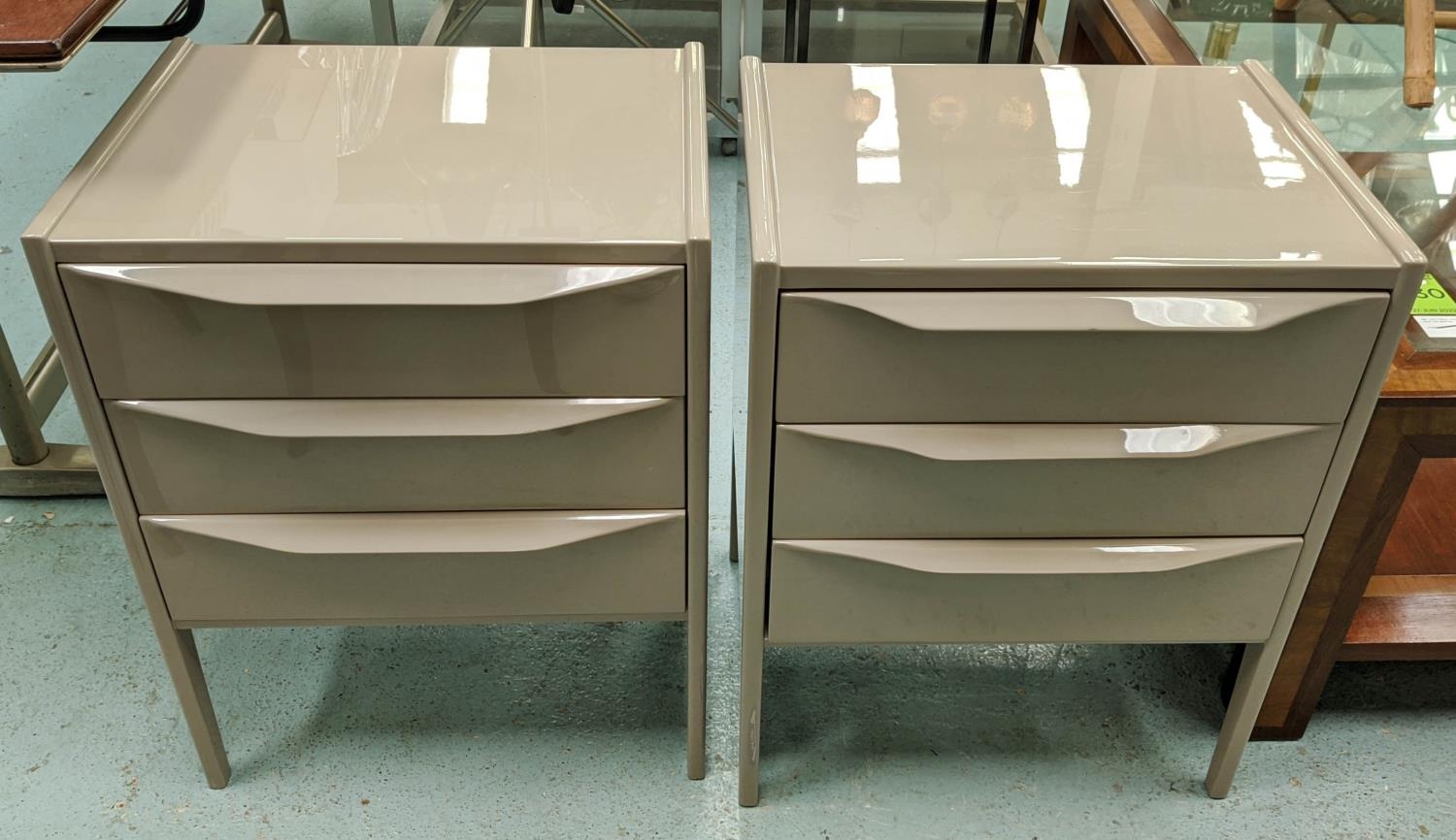 CHELSEA TEXTILES BEDSIDE TABLES, a pair, 50.5cm x 40cm x 64cm, with lip handles. (2)