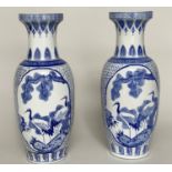 'STORK VASES', a pair, Chinese blue and white ceramic, each with Greek key and Anthemion decorated