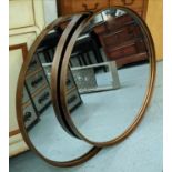 CIRCULAR MIRRORS, a pair, slim bronzed metal frames, 84cm diam. (2)