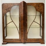 ART DECO DISPLAY CABINET, walnut veneered, having two glazed doors, enclosing two glass shelves,
