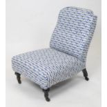 SLIPPER CHAIR, Victorian ebonised, circa 1870, newly upholstered in patterned blue fabric, 75cm H