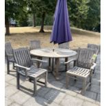 GARDEN TABLE AND CHAIRS, Neptune weathered teak circular slatted with six armchairs and parasol,