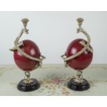 CANDLESTICKS, a pair, mounted ostrich eggs with opposing dragons with red painted finish, 33cm H. (