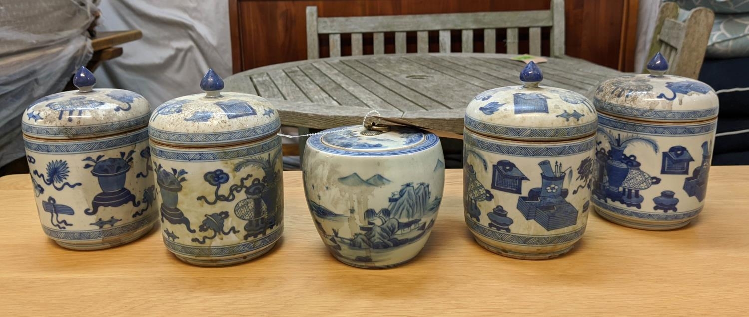 JARS WITH COVERS, a set of four, Chinese export style, blue and white ceramic, and one other, 18cm
