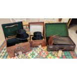 TWO LEATHER HAT CASES, each containing a top hat, one by Christy's, London, together with a