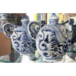 TEA POTS, a pair, 24cm H, Chinese export style blue and white ceramic, Phoenix head detail. (2)
