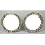 WALL MIRRORS, a pair, 1970s Italian design, geometric inlaid circular frames, 61cm diam. (2)