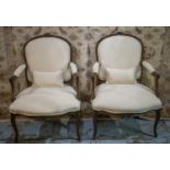FAUTEUILS, a pair, Louis XV style beechwood, striped cream upholstery, 95cm H x 67cm W. (2)