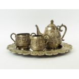 TEA SERVICE, white metal eastern comprising teapot, sugar bowl and milk jug, plus a silver plated