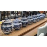 GINGER JARS, a set of eight, 21cm H, Chinese Export style blue and white ceramic, with dragon