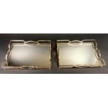 DRINKS TRAYS, a pair, 7cm x 45cm x 30cm, 1960s French style, gilt metal, silvered glass. (2)