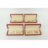 PROPELLING PENS, four boxed sets, each comprising silver propelling pens, two with fluted bodies,