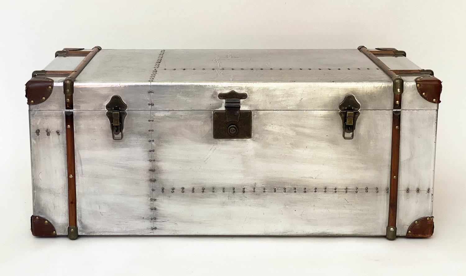 TRUNK, 102cm x 52cm x 41cm H, American aviator style, polished studded aluminium, with rising lid