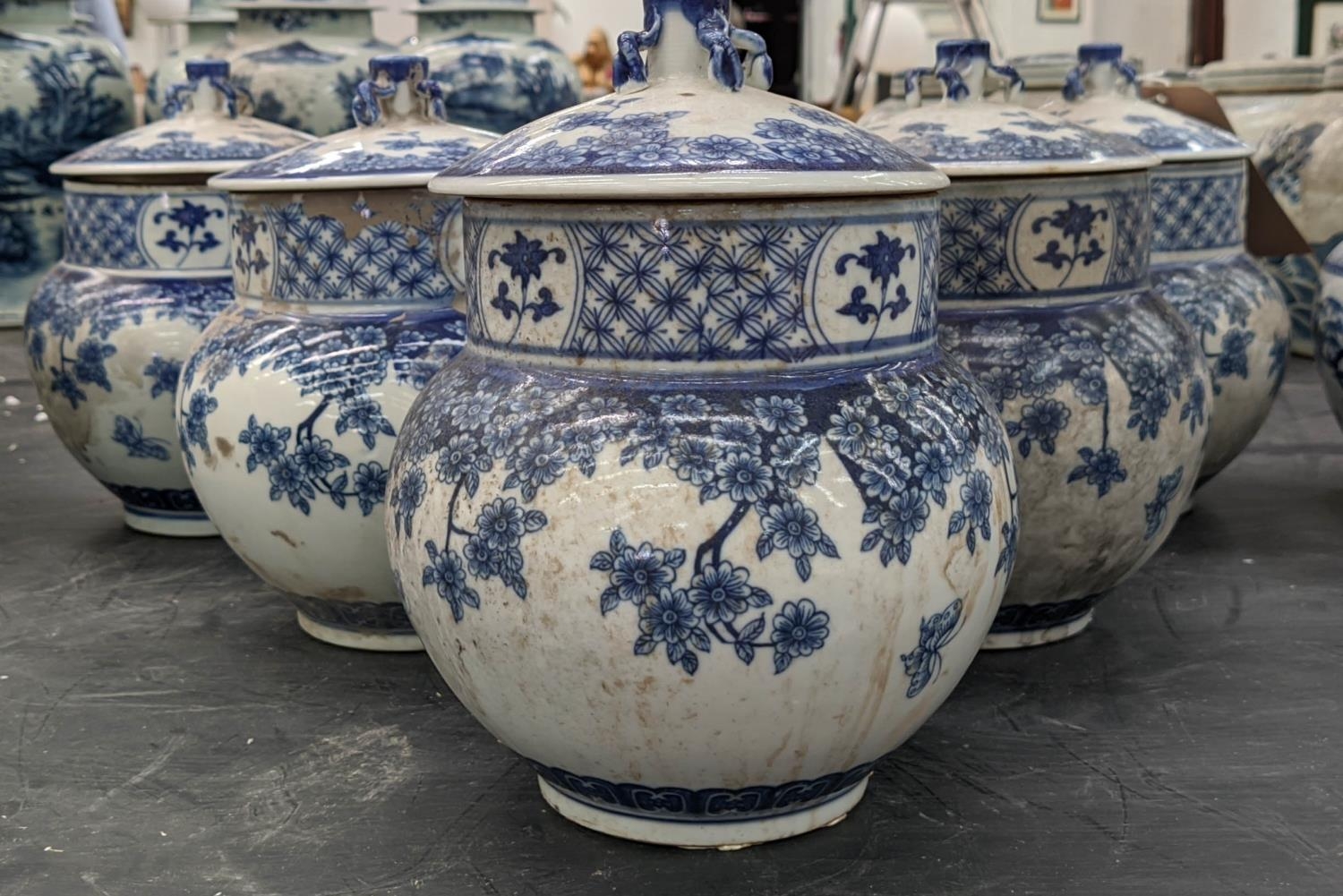 CHINESE JARS AND COVERS, a set of five, 22cm H x 18cm diam., blue and white decoration, of ovoid and