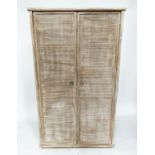 ARMOIRE, bamboo framed and cane bound with wicker panelled doors enclosing full height hanging