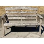 GARDEN BENCH, 126cm W, nicely weathered teak, slatted, with arched back and flat top arms.