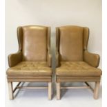 WING ARMCHAIRS, a pair, George III design, with studded light tan leather, each with button
