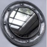 PORTHOLE MIRROR, early 20th century Newlyn style, beaten silvered metal with spheres and circular