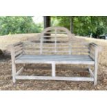 'LUTYENS' STYLE GARDEN BENCH, nicely weathered slatted teak after a design by Sir Edwin Lutyens,