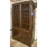 CHINESE CABINET, lacquered firwood, with two grille doors enclosing shelves and two further doors