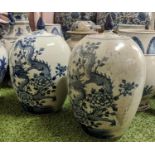 CHINESE TEA JARS AND COVERS, a pair, 35cm H, blue and white decoration, of ovoid form with finial