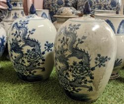 CHINESE TEA JARS AND COVERS, a pair, 35cm H, blue and white decoration, of ovoid form with finial