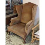 WINGBACK CHAIR, early 20th century in brown velour upholstery, 80cm x 113cm H. (To be sold on behalf