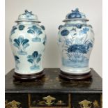 TEMPLE JARS, a matched pair, Chinese blue and white with carved hardwood stands, 50cm H. (2)