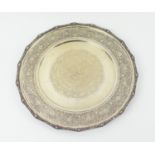 PERSIAN CIRCULAR TRAY, white metal, late 19th / early 20th C, ornately engraved throughout with