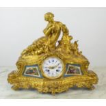 FIGURAL MANTLE CLOCK, 19th century French ormolu, with Sevres style panels, marked Rollin a Paris,