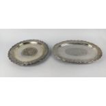 PERSIAN/ISLAMIC WHITE METAL TRAYS, two, comprising one oval tray and one circular tray, each