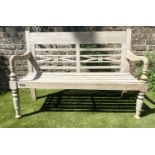 COLONIAL STYLE BENCH, weathered teak with down swept arms and crossed pierced back, 115cm W.