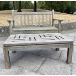 GARDEN BENCH by Barlow Tyrie, well weathered slatted teak together with a lattice low table, 166cm
