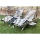 GARDEN SUN LOUNGERS, a pair nicely weathered teak, with rising adjustable back and leg section and